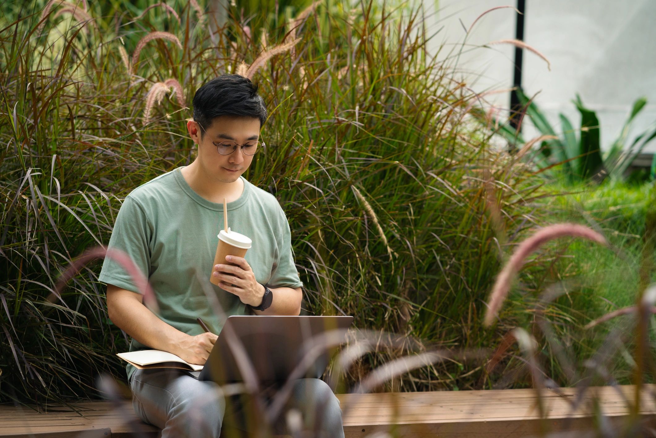 Developer working on a laptop outdoors