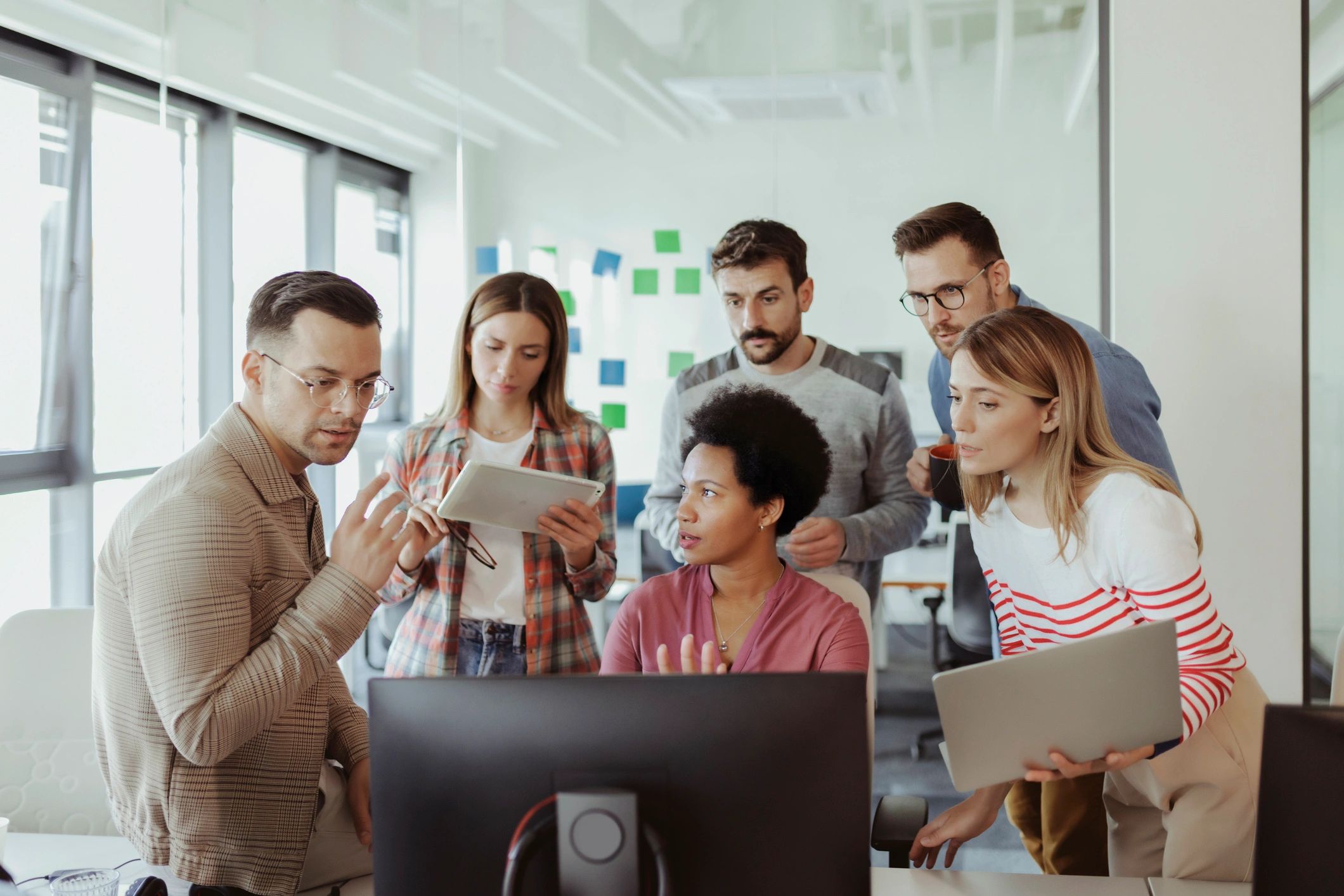 Software team collaborating in a bright office