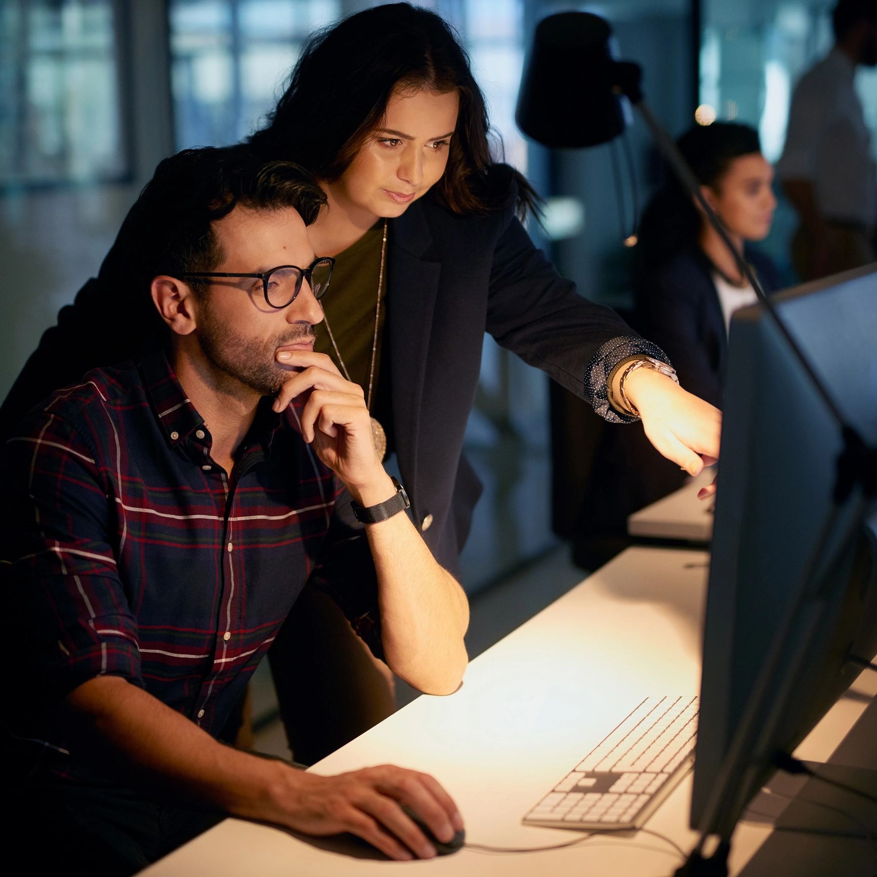 Colleagues collaborating at a computer